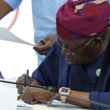 WhatsApp Image 2025-05-28 at 16.33.44_82f51f8d Photos: President Bola Tinubu Signs The ECOWAS 50th Anniversary Card