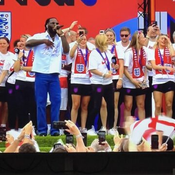Video: Dutch Football Manager Sarina Wiegman, Loses Composure As Favourite Artist Burna Boy, Joins Her On Stage At England Parade