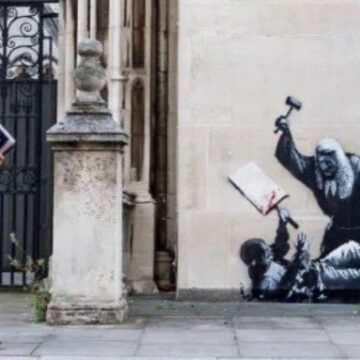 WhatsApp Image 2025-09-09 at 08.22.28_b20bd8e9 Update: Elon Musk Uses xAI Grok Imagine To Bring Banksy Mural, That Appears At The Royal Court Of Justice In London To Life, After Court Censors It By Covering It Up