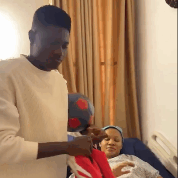 Nigerian Content Creator ‘Remote’, Induct His Newborn Into Arsenal Football Club At The Hospital, As Wife Welcomes Baby.
