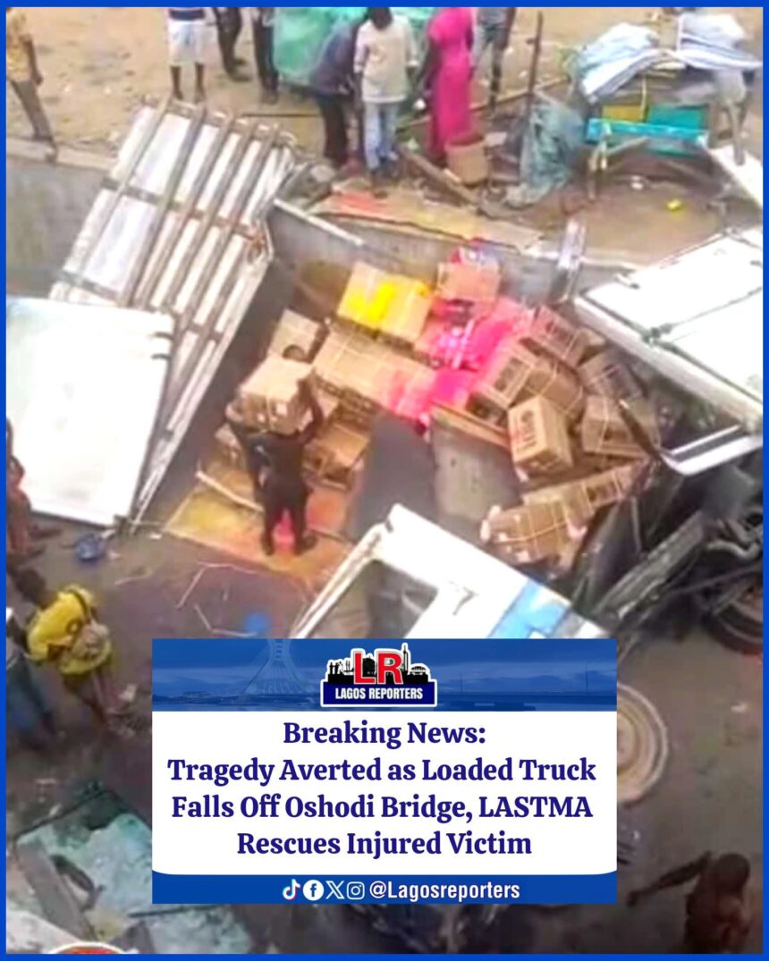 Tragedy Averted as Loaded Truck Falls Off Oshodi Bridge, LASTMA Rescues Injured Victim