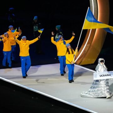 Russian Woman Carries Ukraine Placard At Winter Olympics Opening Ceremony