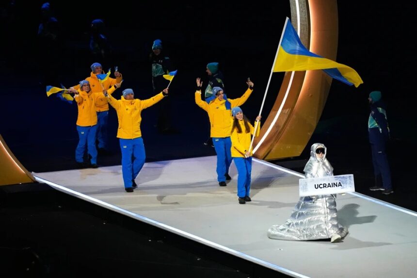 Russian Woman Carries Ukraine Placard At Winter Olympics Opening Ceremony