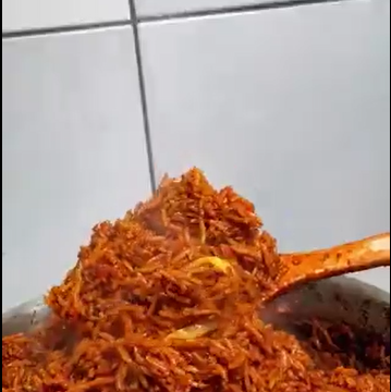 The Making Of Smoky Nigerian Jollof Rice