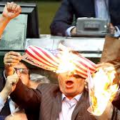 Iranian Lawmakers At The Parliament Set U.S. Flag On Fire While Chanting “Death To America.”