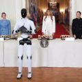 First Lady Melania Trump Grand Entrance At The White House Walking Side-By-Side With An American-Made Humanoid Robot During Day Two Of The Fostering The Future Together Global Coalition Summit.