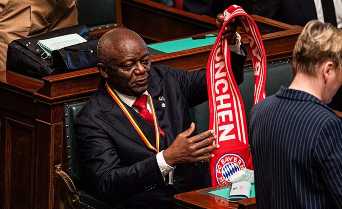 Sport Photo News: Vincent Kompany FC Bayern’s Manager’s Father Pierre Kompany Turnes Up To The Brussels Parliament In Belgium With A Bayern Scarf