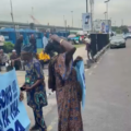  Nigerian Retirees Demands 16 Years Pension At NPA Entrance Gate, 69-Year-Old Woman Cries Out In Pain
