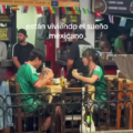 FIFA WC Moment: Mexican Man Beam With Joy Watching A Korean Couple Wearing Mexico National Team Jerseys Eating Tacos In The City Restaurant.